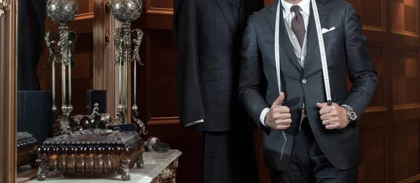 Tailor hands expensive tailoring individual suits — Stock Photo, Image