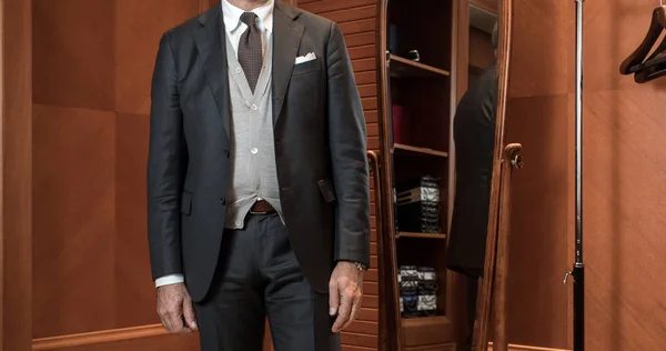 Stylish man in suit in wardrobe — Stock Photo, Image