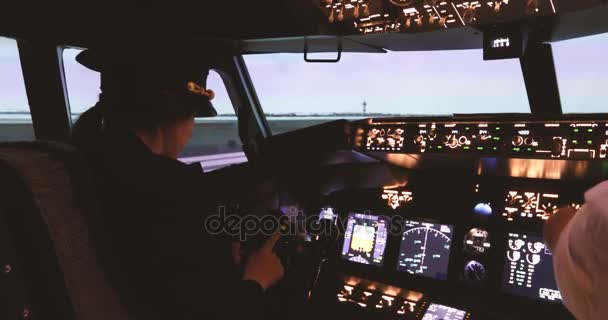 Female pilot captain prepares for take-off plane — Stock Video