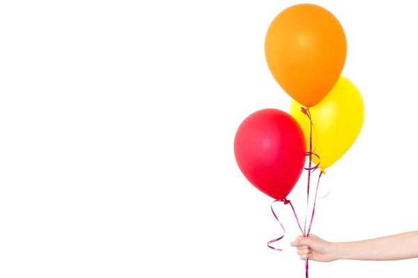 Womans hand holds balloons in a white background — Stock Photo, Image