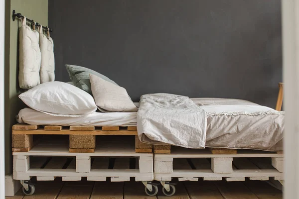 Industrial style bedroom recycled pallet bed frame