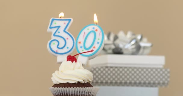 Thirty 30 candle in cupcake pastel background — Stock Video