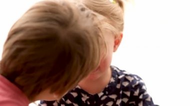 Little boy calm the crying girl isolated