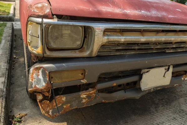 The rusted ruins of an old automobile left to rust.