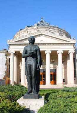 Statue of Mihai Eminescu before Romanian Athenaeum (Concert Hall) in Bucharest, Romania clipart