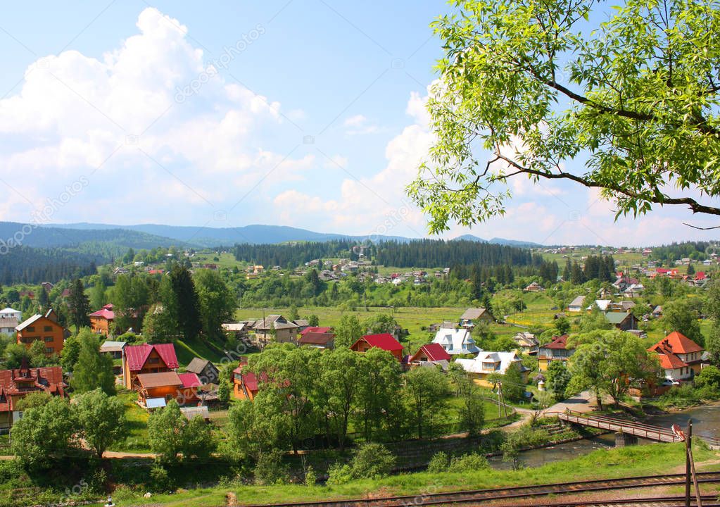 Landscape in Vorohta with mountains, river and railroad, Ukraine