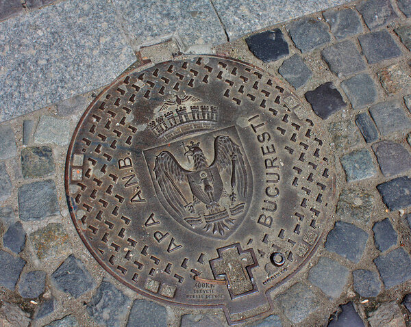 Bucharest - May 5, 2017. Channel cover of a sewerage system in Bucharest, Romania