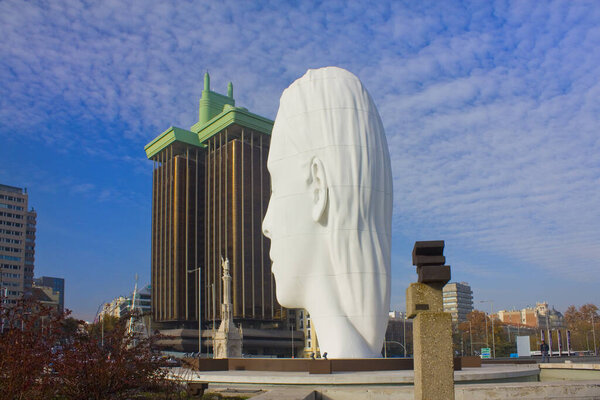 MADRID, SPAIN - 17 January, 2020: Julia - white marble sculpture by Jaume Plensa at Plaza Colon in Madrid