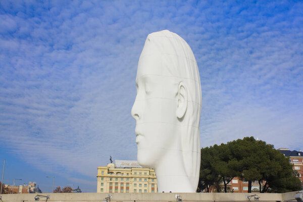 MADRID, SPAIN - 17 January, 2020: Julia - white marble sculpture by Jaume Plensa at Plaza Colon in Madrid