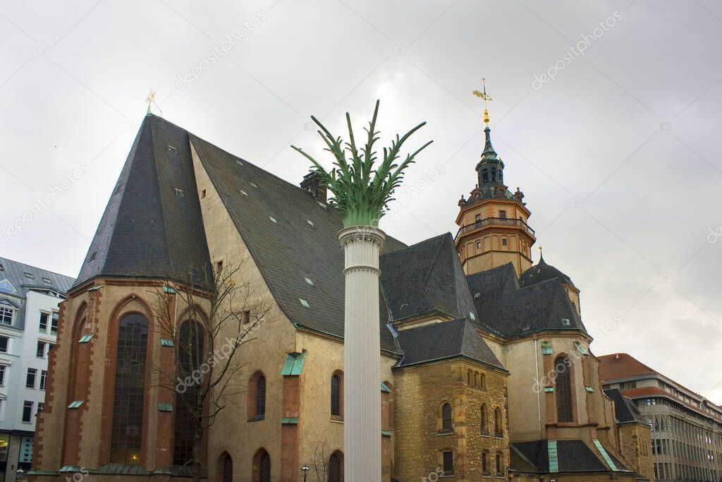 Column Nikolaisaule and St. Nicholas Church (Nikolaikirche) in Leipzig, Germany