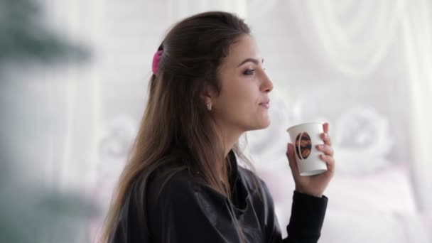 Young model drinking from plastic glass — Stock Video