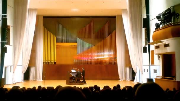 Minsk, Belarus - March 2018: People listen to the music of F. Liszt at a concert of organ music — Stock Video