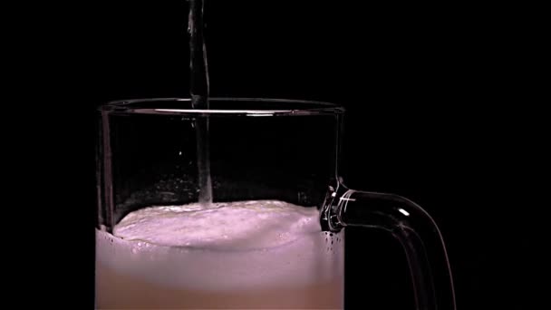 Pouring Light Beer and Foam - Close-Up, black background — Stock Video