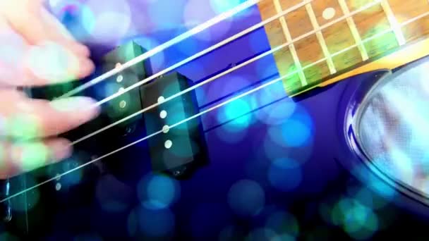 ギタリスト ロックベースギター アブストラクトベースギター クローズアップ ライトFx — ストック動画