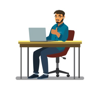 Business man at the desktop with a laptop. Freelancer or office worker.