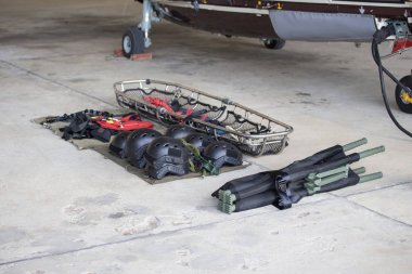 searh and rescue equipment arrange on ground before mission with clipart