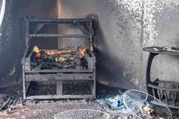 chair and furniture in room after burned by fire in burn scene o