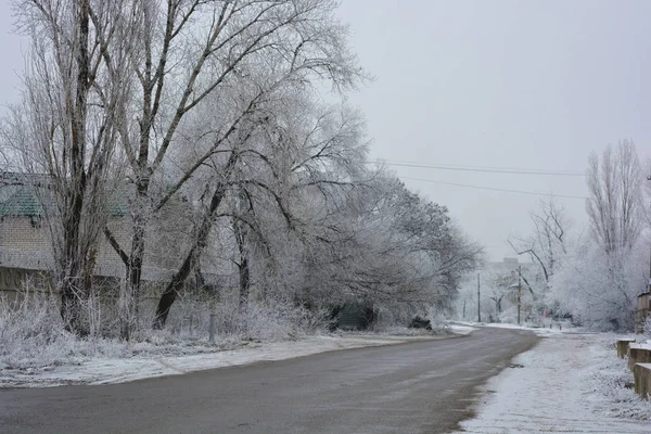 Street with its structures, buildings and structures, trees, landscape under a layer of umbilical snow in the winter. Beautiful, the landscape on the housing estate Northern, city Dnipro Ukraine.