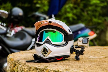 Enduro motorcycle helmet with action camera clipart