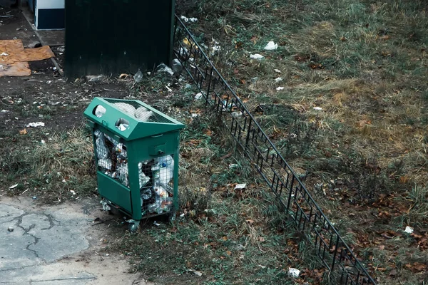 Filled dumpster. Nature pollution, bad ecology.