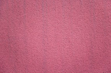 Parlak pembe sıva duvar. Yakın plan.