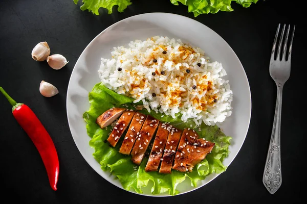 Teriyaki Chicken Sesame Seeds Lettuce Rice White Plate Dish Fork — Stock Photo, Image