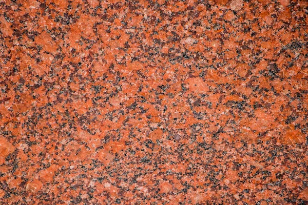 Background from an orange granite slab close up