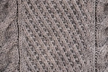 Örülmüş, rahat bir süveterin dokusu. Örgü, ev aksesuarları..