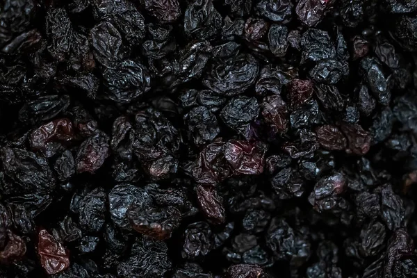 Background of dried raisins. Vegetarian sweets for diet food.