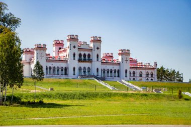 Restoration of an old medieval castle. Beautiful facade of the palace in Kossovo, Brest region, Belarus. Summer sunny landscape. clipart