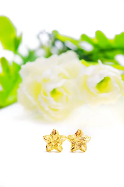 Gold pendant cameo earring jewelry in star shape with flowers is — Stock Photo, Image