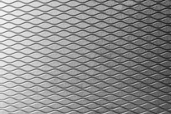 검은색에서 고무 배경의 물결 라인 패턴 질감 — 스톡 사진