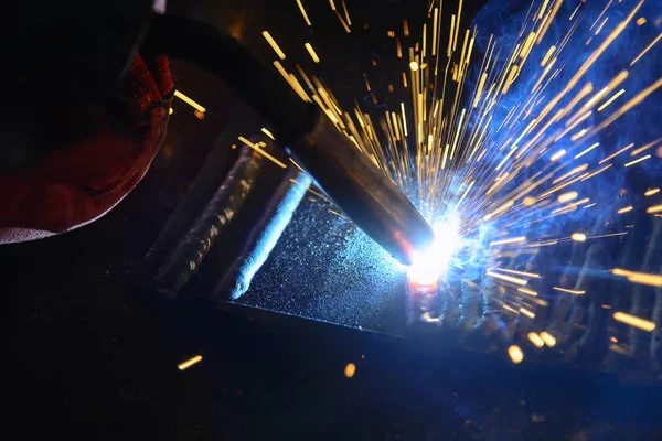 the welding spark light in close-up scene,the torch of welging m