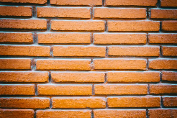 Fechar a parede de tijolo de argila vermelha com o efeito da lente . — Fotografia de Stock