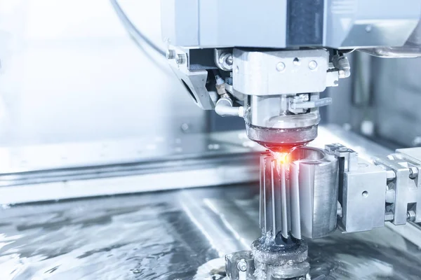 stock image Close-up of the wire - EDM CNC machine while cutting the sample 