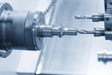 CNC torna makinesi veya çelik çubuğu delen dönme makinesi .