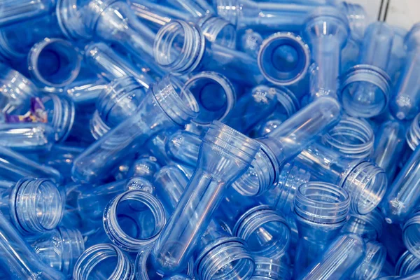 The  raw material for plastic bottle blowing process .