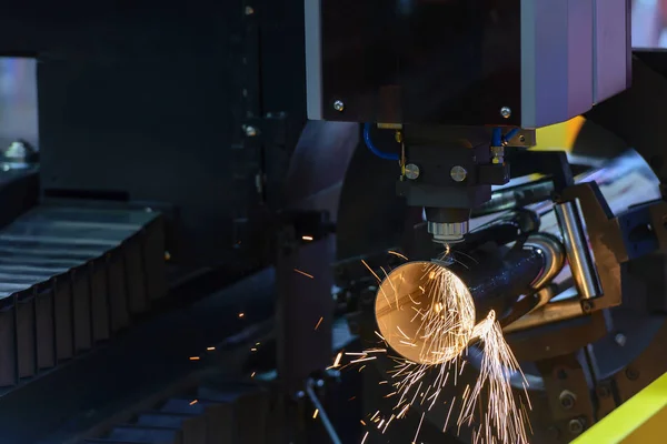 The fiber laser cutting machine cutting the steel pipe