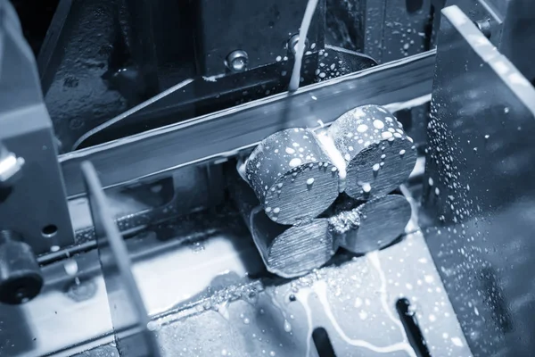 The operation of band saw machine cutting the metal rod. — Stock Photo, Image