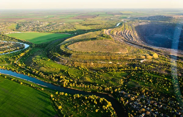 Aerial shot of huge open pit at sunset — Stock Photo, Image