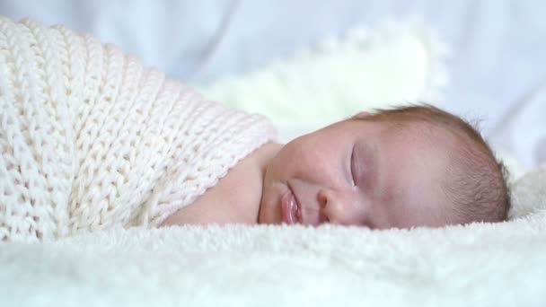 Infant baby portrait lie in white — Stock video