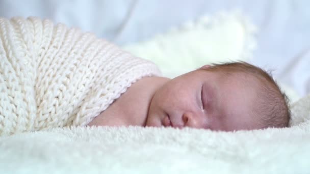 Infant baby portrait lie in white — Stockvideo