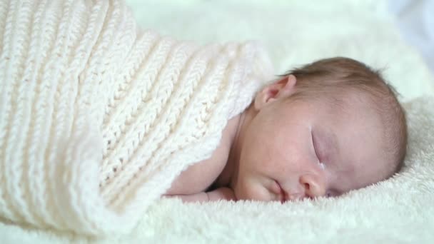 Infant baby portrait lie in white — Stockvideo