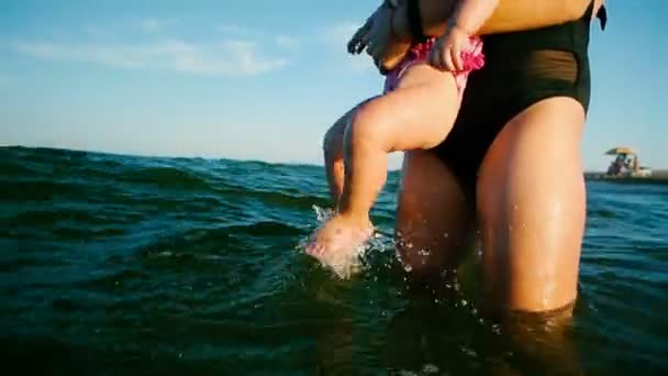 Caucasian Female Baby First Time Sea Jump Water Have Fun — Stock Video
