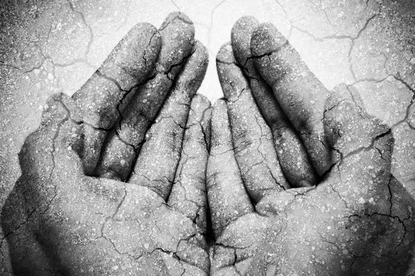 Double exposure hunger begging hands and dry soil. Represent that lot of people in the world are hungry and starvation, they need help and hope for better life