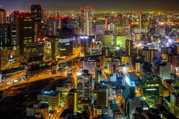 Oska city, Japan night view showing modern Japan big city with bright light and high tower.