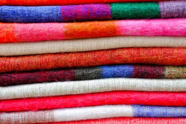 Colorful Knitting Wool Fabric Scarf Folded Stacked Together Row Background — Stock Photo, Image