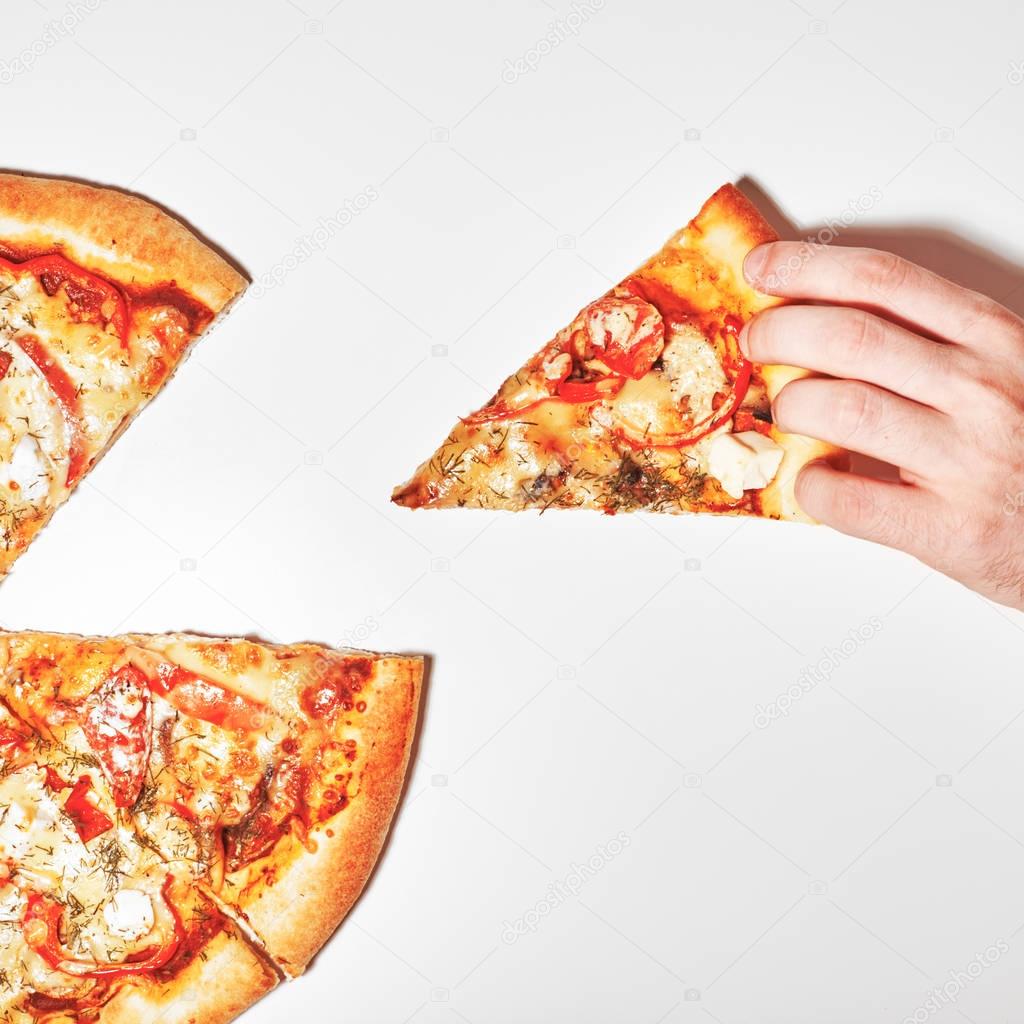 Top view. Flat lay photograph of tasty italian pizza on white background