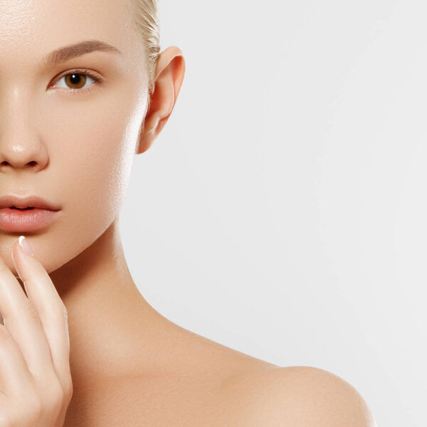 Skincare, Wellness, Spa. Clean soft Skin, healthy Fresh look. The concept of a healthy skin. Portrait of a beautiful girl against a white background. Spa concept. Natural beauty