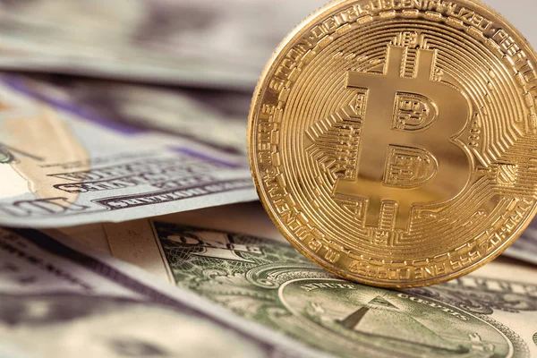 Bitcoin logo on dollars close up — Stock Photo, Image